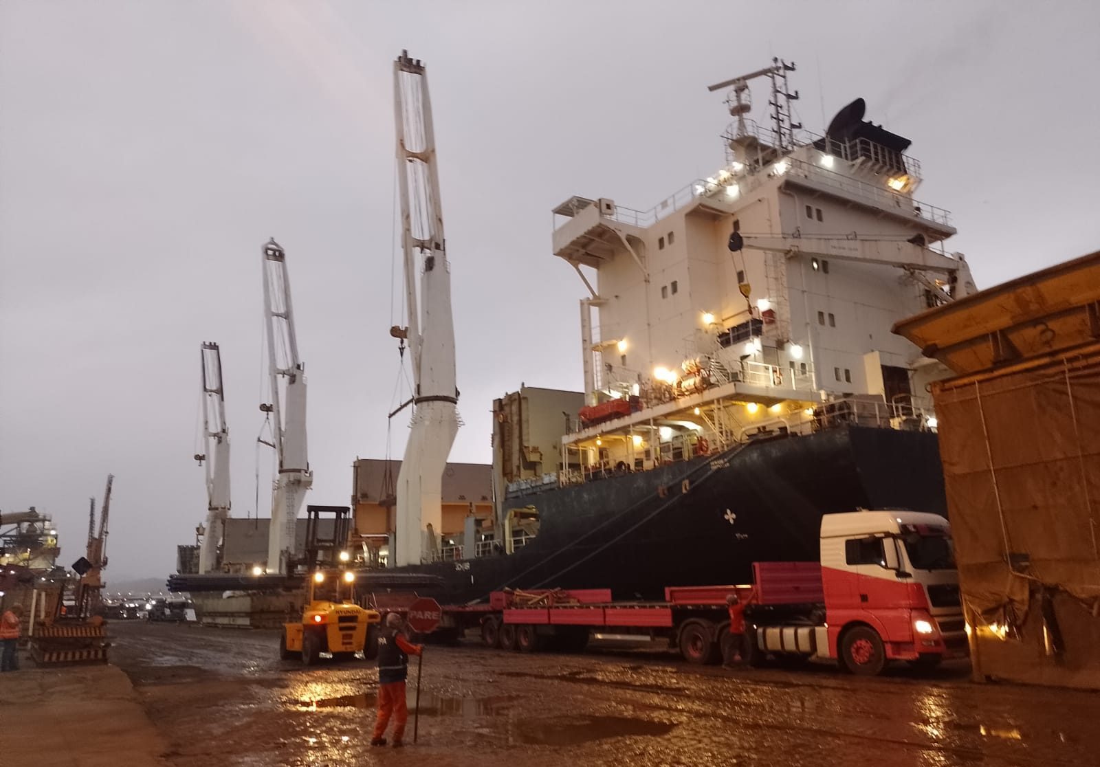 Port cranes and vessel during an evening loading operation